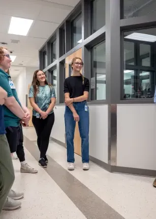 Students listen during a tour of the Maine Correctional Center. 