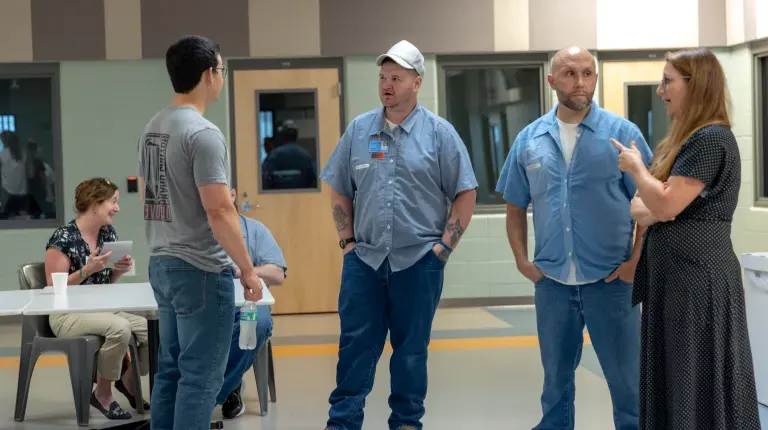 Trisha Mason talks with residents of the Maine Correctional Center. 